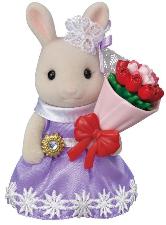 Město - králík s květinovými dary 